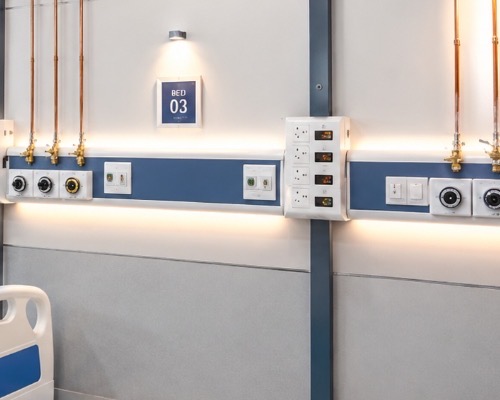 Segregated high voltage power sockets, nurse call handsets, and POAG ground studs